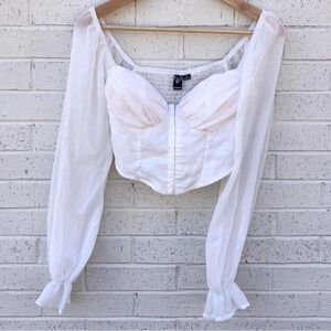 Windsor White corset top with sheer long sleeves
Size: S